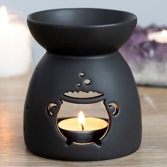 Black ceramic wax melter and oil burner, with charming bubbling cauldron cut out.