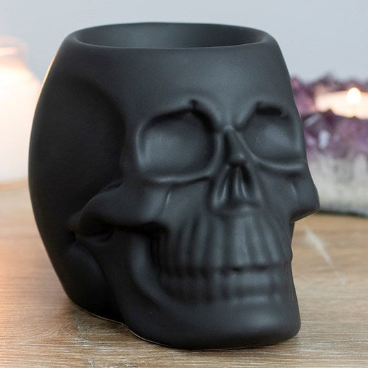 Black skull shaped wax melter and oil burner.