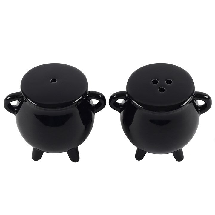 Two black cauldron-shaped salt and pepper shakers.