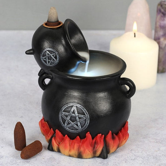 Pouring cauldron shaped backflow incense burner.  Flame and pentagram detailing, with eerie light up effect.