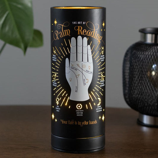 Electric wax melter and oil burner with a tarotcore palm reading design. 