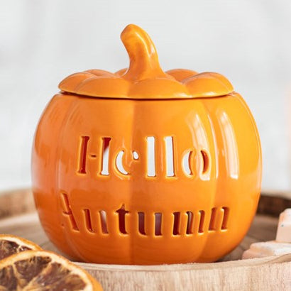 Ceramic pumpkin wax melter & oil burner with hello autumn text cutout.