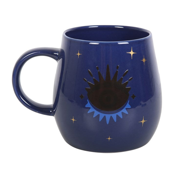 All Seeing Eye heat-changing ceramic mug. Design changes from a closed eye to an open eye when the mug is hot.