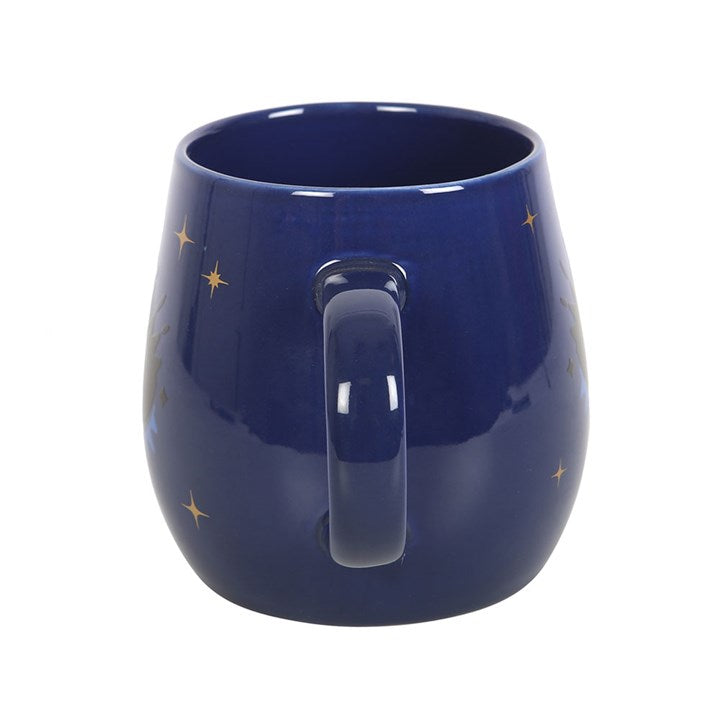 All Seeing Eye heat-changing ceramic mug. Design changes from a closed eye to an open eye when the mug is hot. Side view.