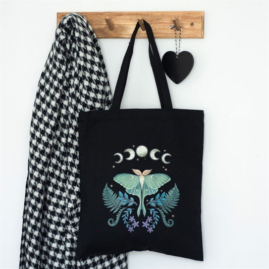 Black tote bag with striking luna moth celestial design.