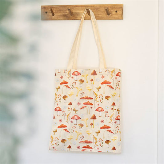 White tote bag with mushroom illustrations. 
