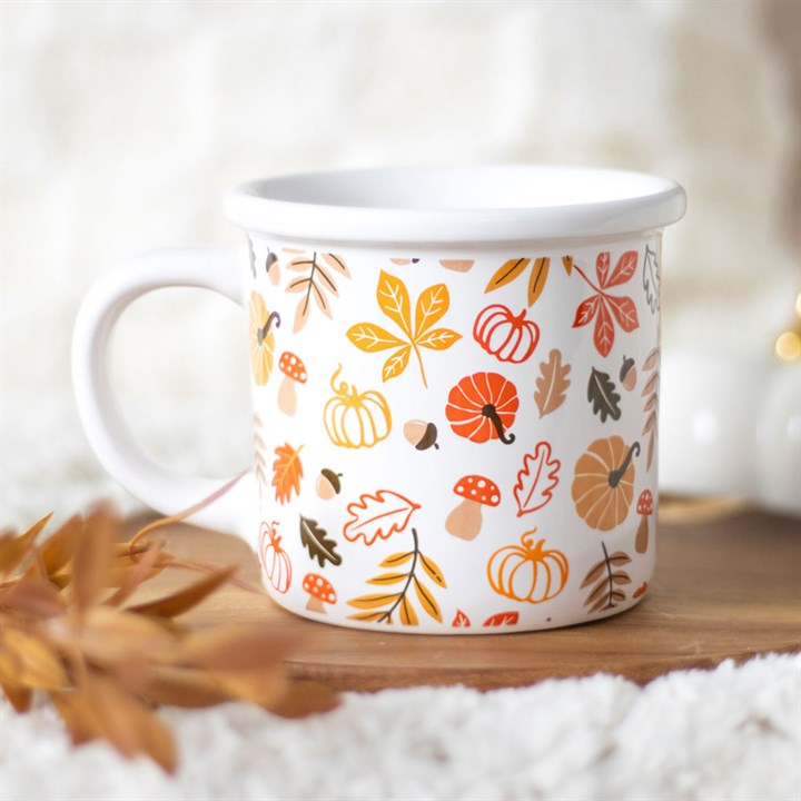 White enamel mug with autumnal leaves, mushrooms, acorns and pumpkins print. 