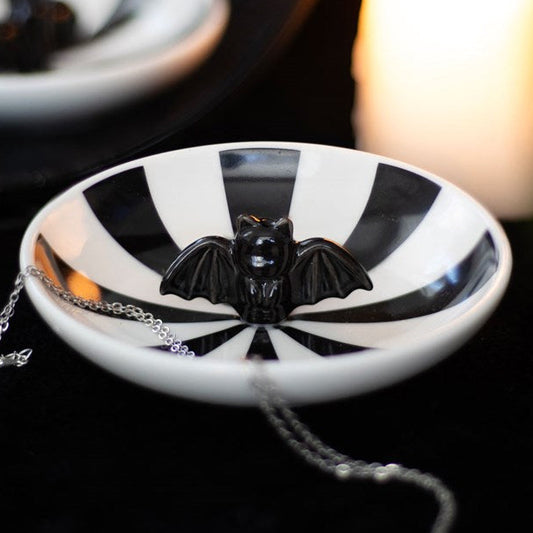 Black and white striped trinket dish, with a 3D bat in the center.