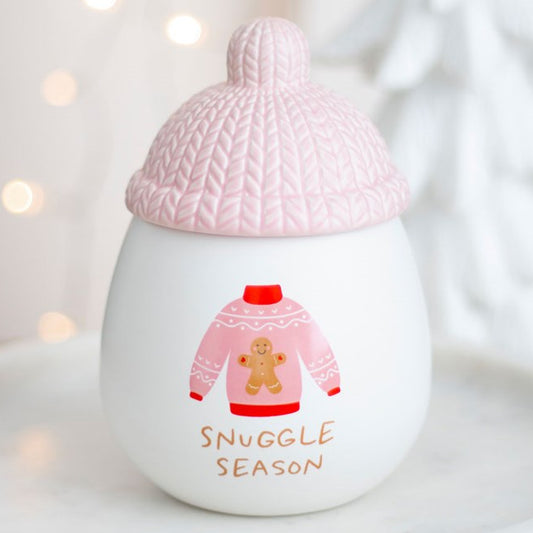 Ceramic snuggle season wax melter and oil burner, topped with a bobble hat-shaped lid.