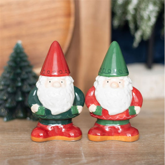 Two ceramic gnome-shaped salt & pepper shakers with red and green hats.