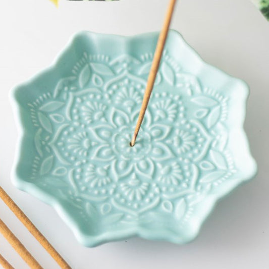 Blue mandala shaped incense stick holder. 