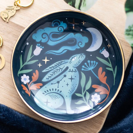 Circular trinket dish depicting a midnight hare gazing at a crescent moon, with vintage-style fauna embellishments. 