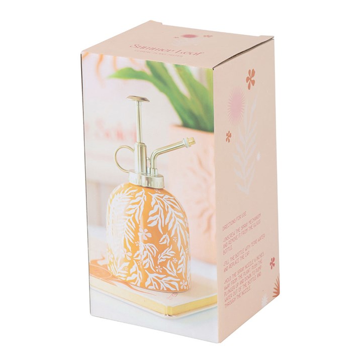 Ceramic yellow plant mister with a white leaf motif and silver-effect spray pump. Presented in a themed box. 