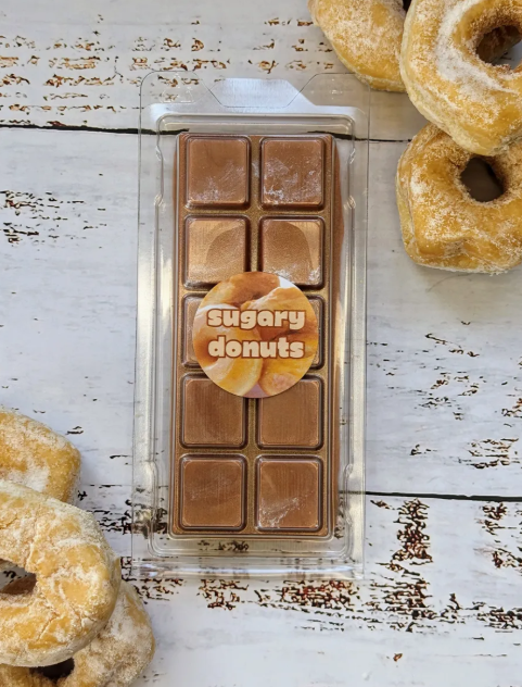 Sugary Donuts coconut wax melt. Light brown snap bar with silver shimmer accents. 