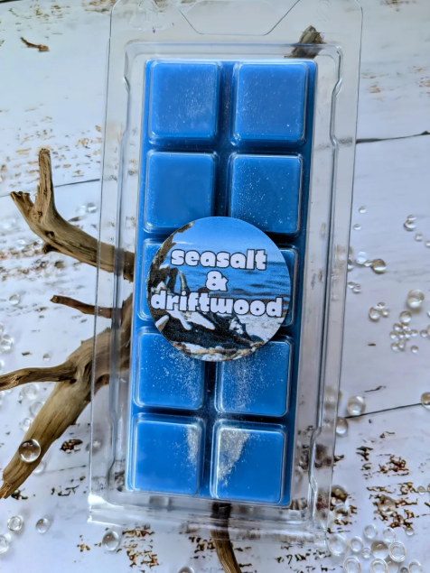 Seasalt and driftwood coconut wax melt. Deep blue snap bar with silver shimmer accents. 