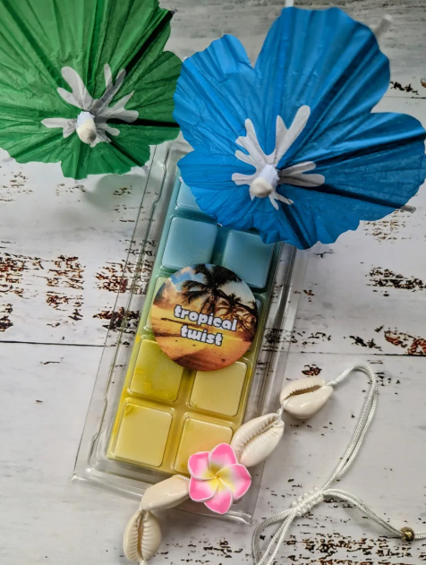 Tropical Twist coconut wax melt. Light blue and yellow ombre snap bar with shimmer accents.