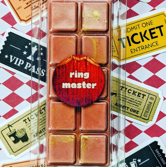 Ring Master coconut wax melt. Deep red snap bar with golden shimmer accents.