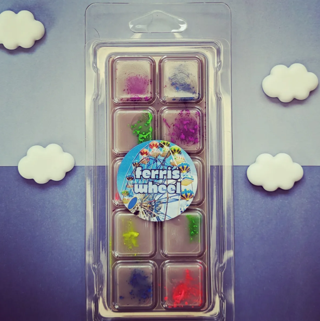 Ferris Wheel coconut wax melt. Grey snap bar with purple, blue, green, red and yellow shimmer accents.