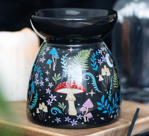 Black gloss ceramic wax melter and oil burner with dark forest inspired flora and fauna print. 
