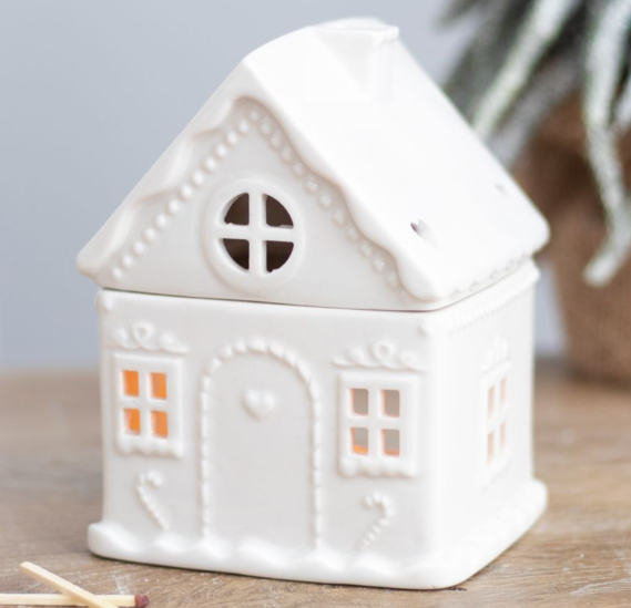 Ceramic wax melter and oil burner shaped like a traditional gingerbread house. 