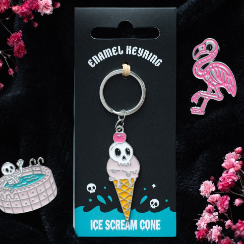 Adorable icecream cone shaped enamel keyring with spooky skull topping.
