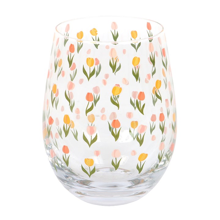 Clear rounded water glass covered in a tulip motif. 