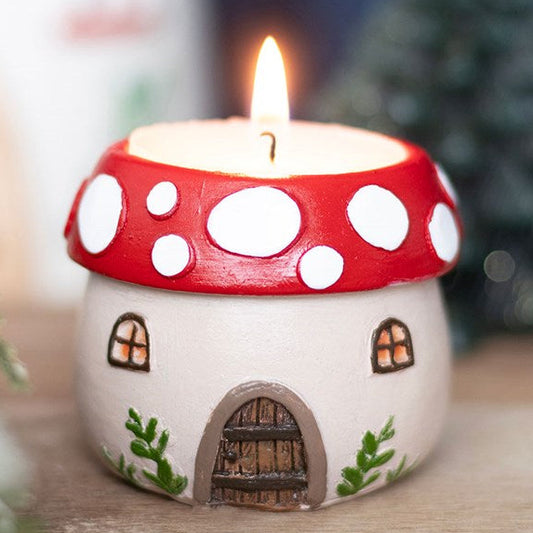 Adorable resin tealight holder shaped like a charming toadstool fairy house. 