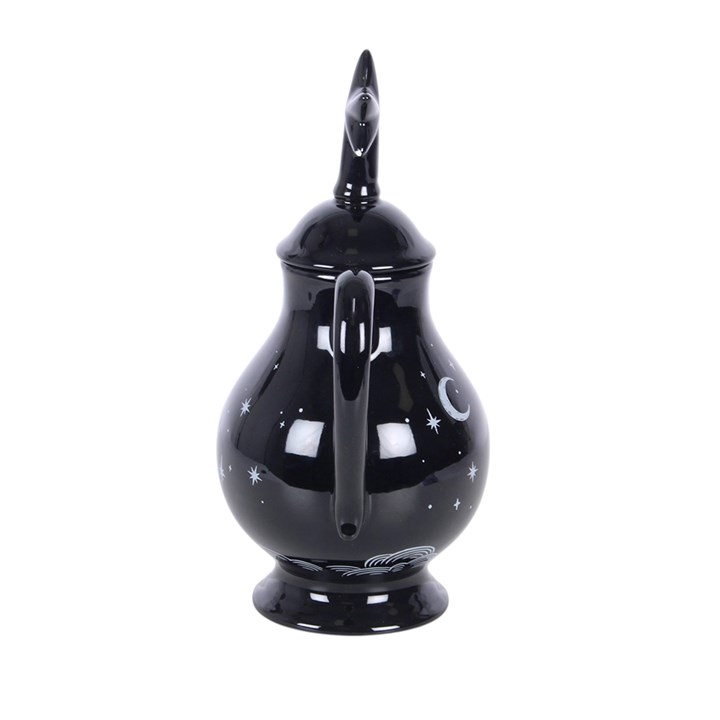 Striking tea pot with celestial design on a black background and a star-capped lid. 