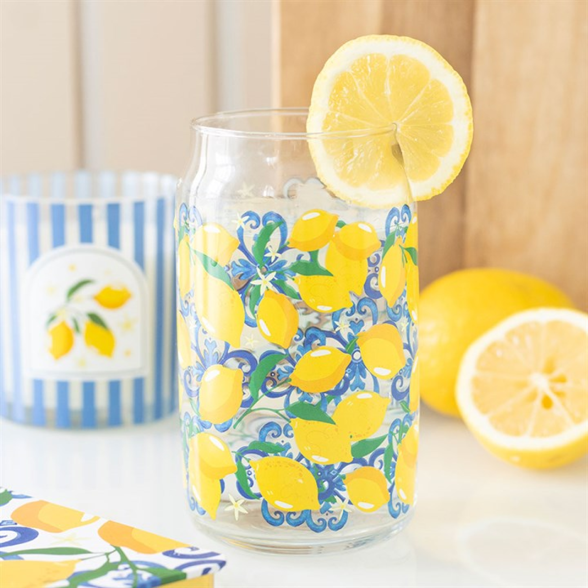 Can-style water glass decorated with lemon fruit motif. 