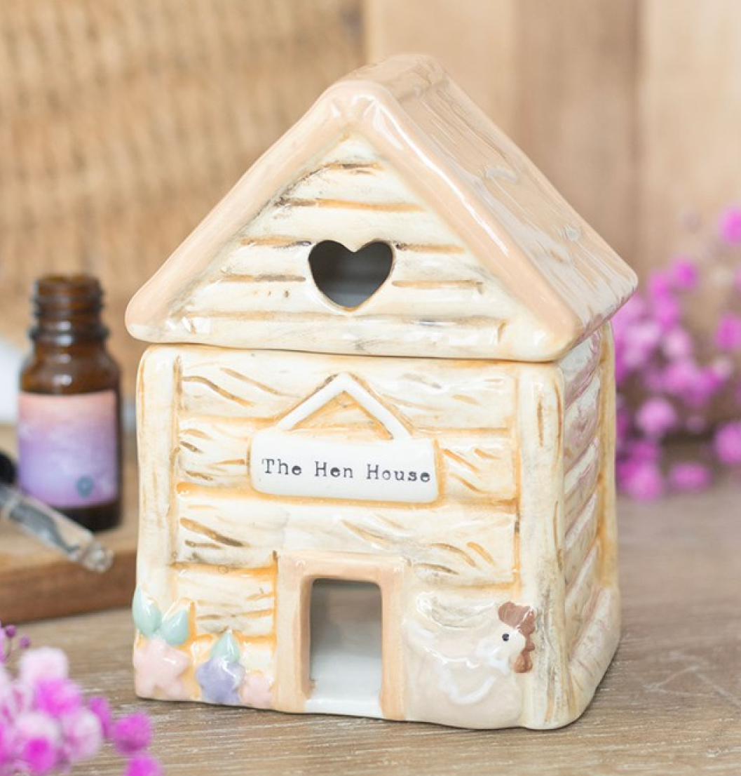Ceramic hen-house shaped wax melter and oil burner. With heart shaped cut out and The Hen House sign. 