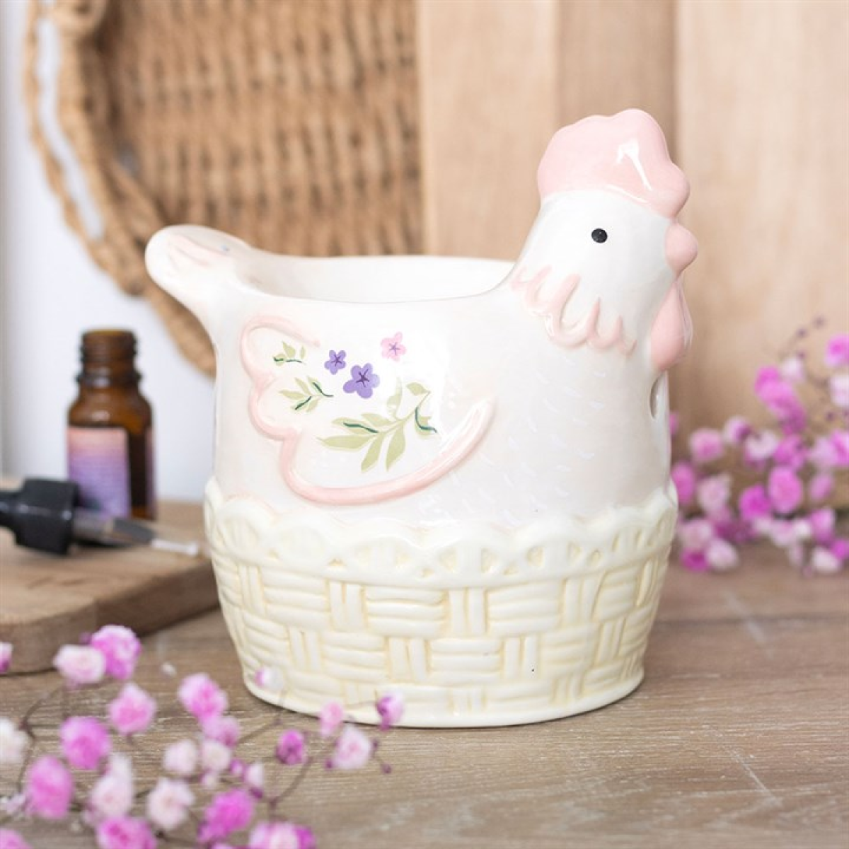 Traditional egg-basket hen shaped ceramic wax melter and oil burner.