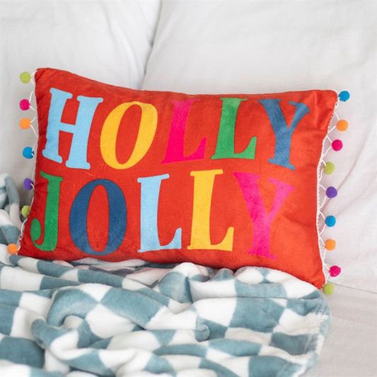 Rectangle red cushion with colourful Holly Jolly text and multicoloured mini-pop pom embellishments.