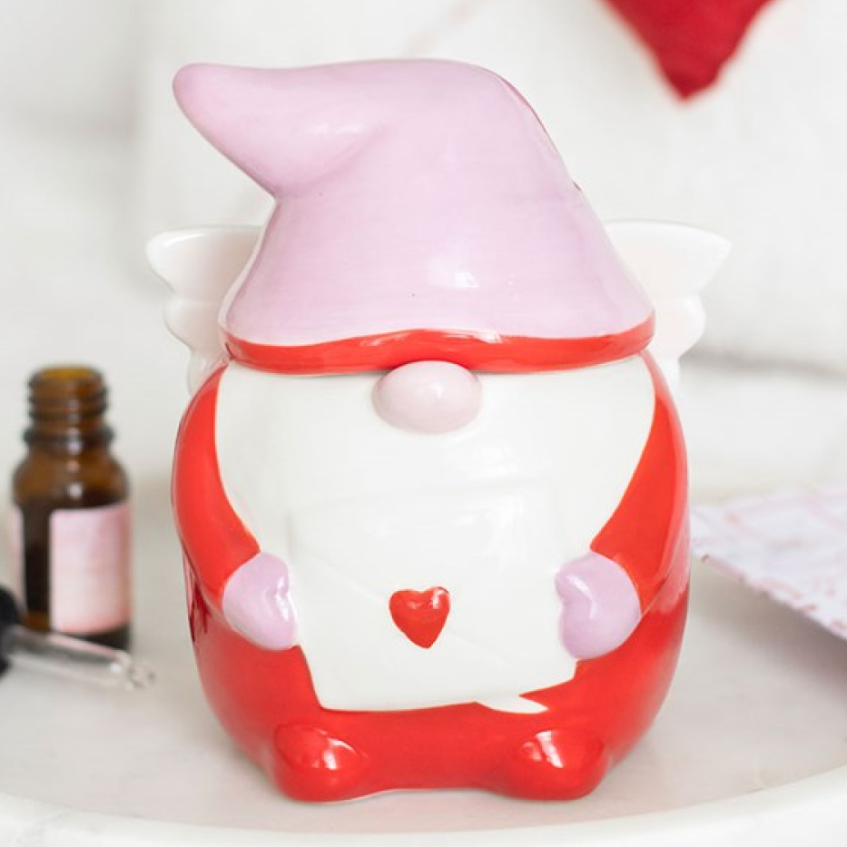 Cupid style scandi gonk ceramic wax melter and oil burner with removable hat, wings and love letter. 