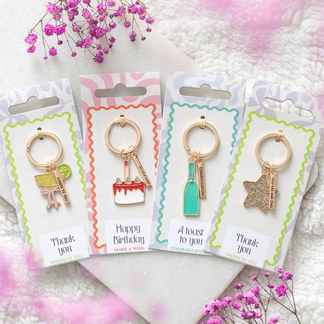 Set of 24 enamel party-icon keyrings. Champagne bottle, cocktail glass, star and birthday cake. 