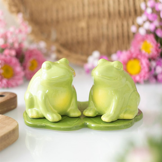 Frog shaped ceramic salt and pepper set on a lily pad tray. 