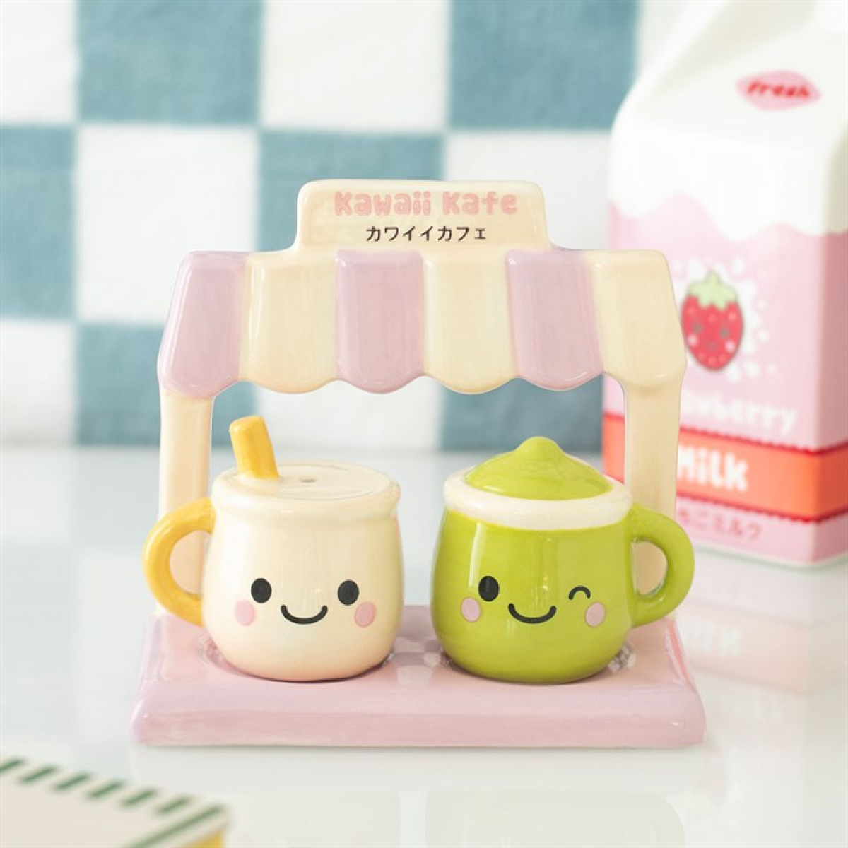 Two kawaii latte & matcha salt and pepper shakers presented on matching cafe stand.