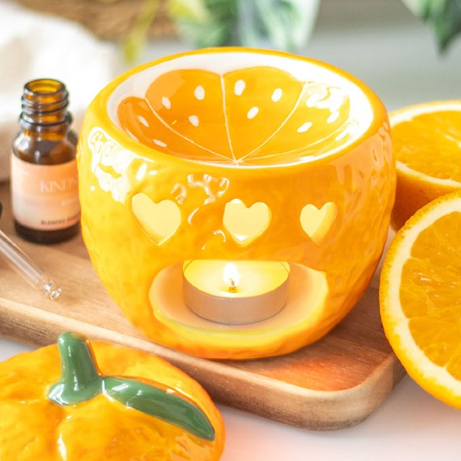 Ceramic orange shaped wax melter and oil burner.
