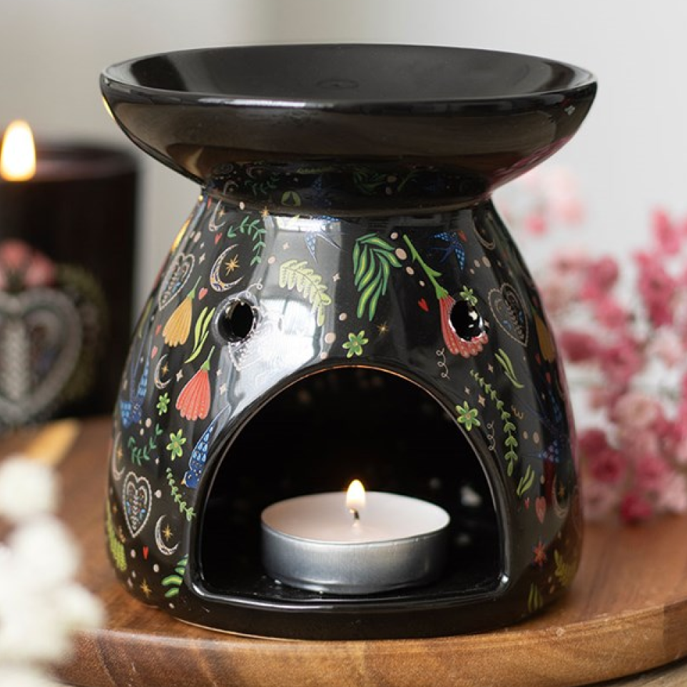 Black gloss ceramic wax melter and oil burner with folksy fauna and flora print. 
