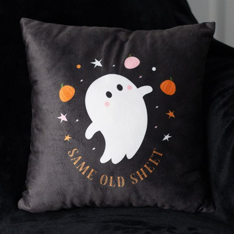 Black square throw cushion with tongue in cheek 'Same Old Sheet' text and adorable ghost motif. 