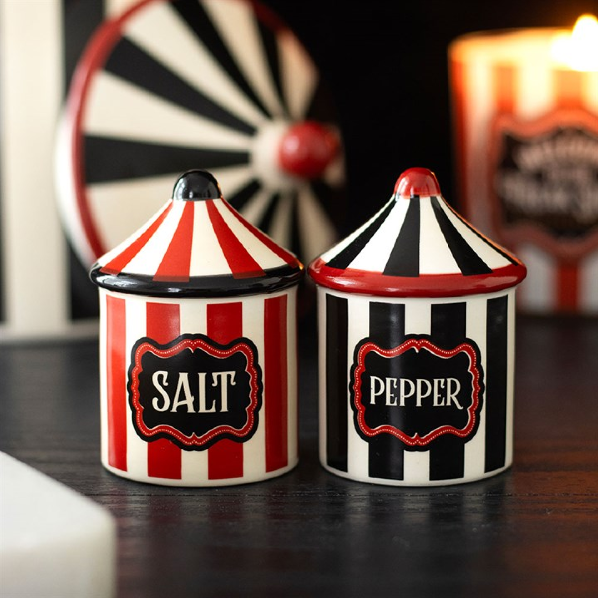 Two circus tent-shaped salt and pepper shaker set in a vintage style.