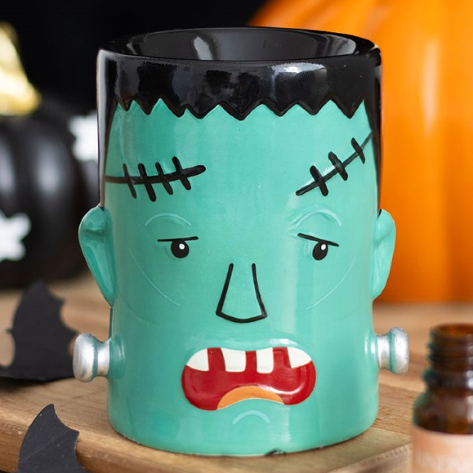 Ceramic Frankenstein's Monster shaped wax melter and oil burner. 
