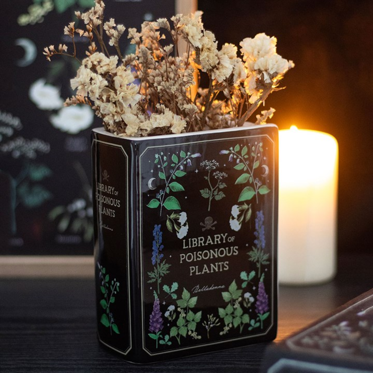 Library of Poisonous Plants book-shaped ceramic flower vase.