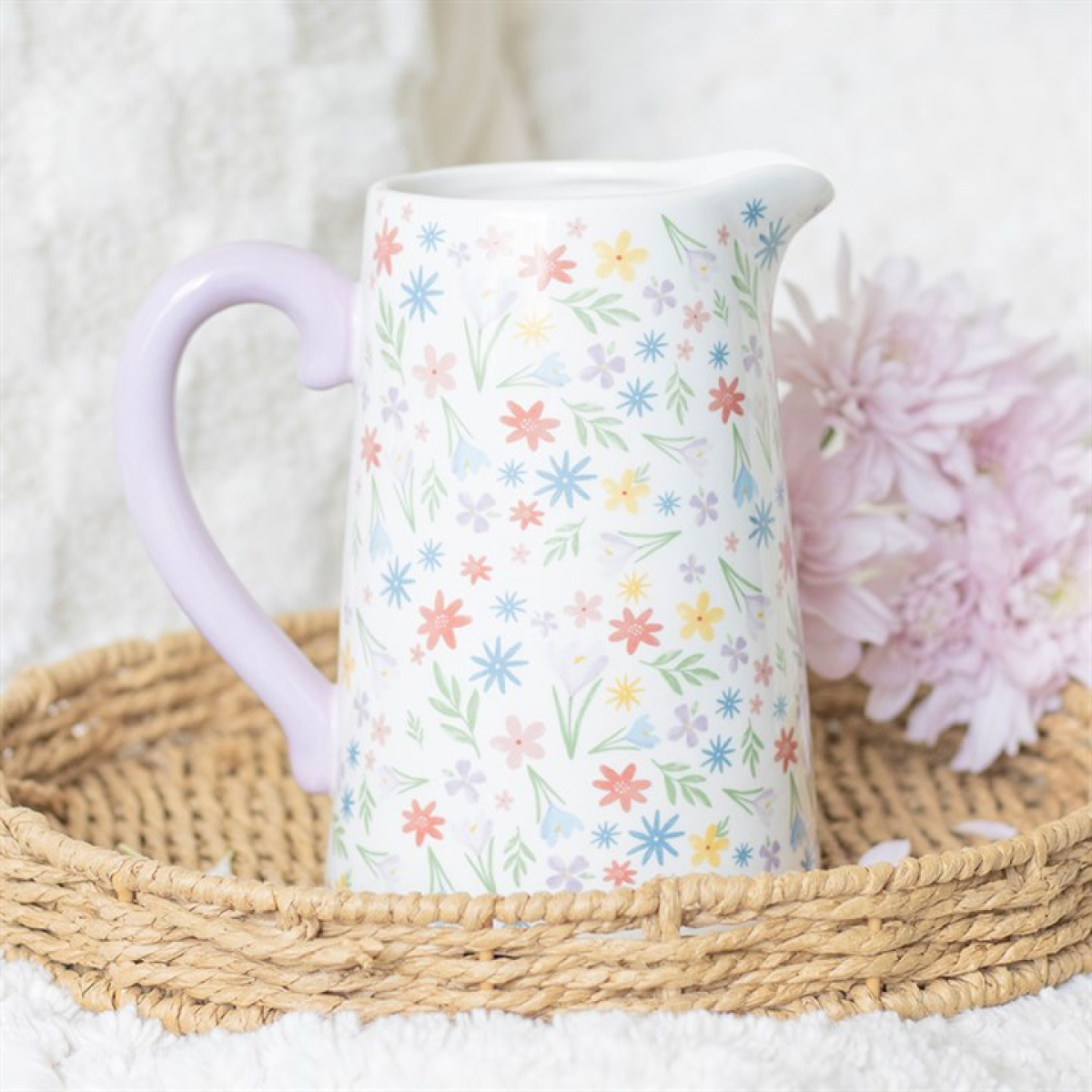 white ceramic flower jug with pastel floral motif. 