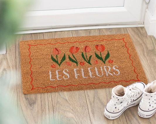 Decorative natural doormat with tulip design and 'Les Fleurs' text.